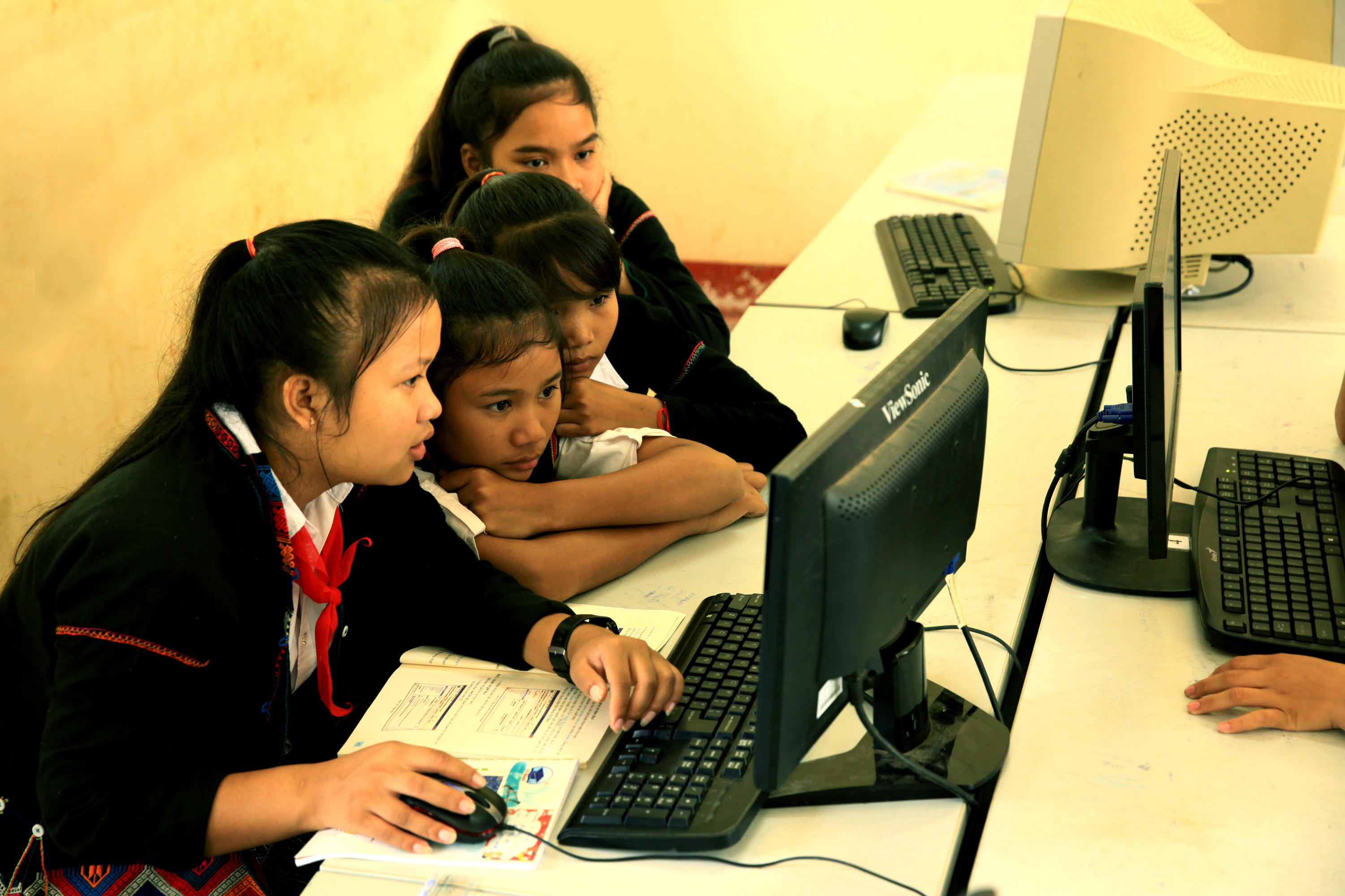 Schoolchildren using a computer