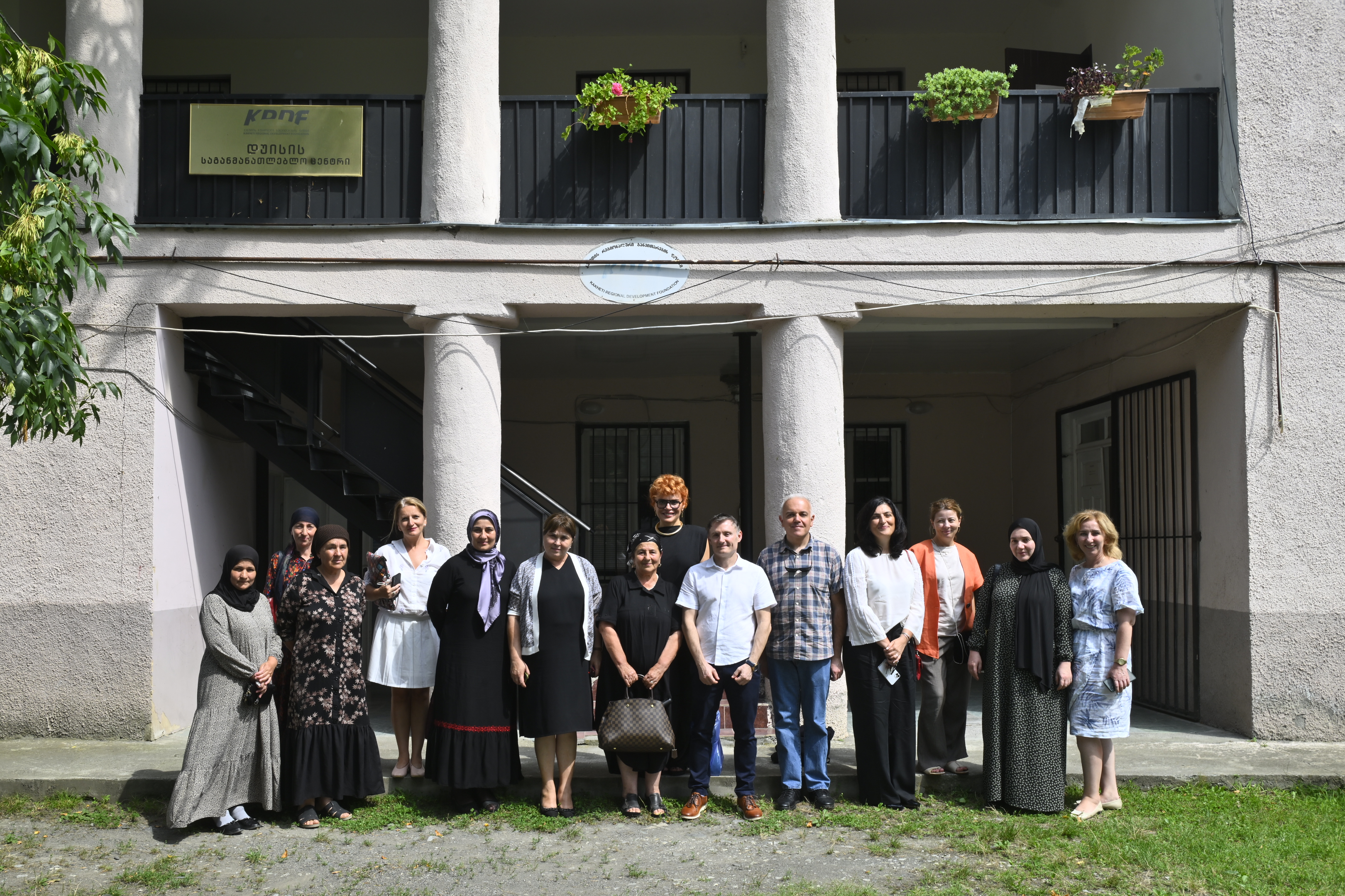 A group photo of senior UN officials and partners in front of a crisis centre in Georgia.