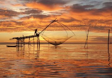 sunset view of old fashioned fishing nets