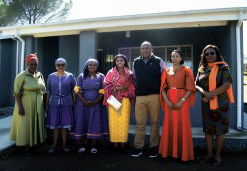 High-level UN officials and national partners in Lesotho pos for a photo together.
