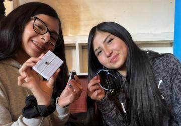 Two Chilean girls participate in a workshop about using electrical circuits for communications. 