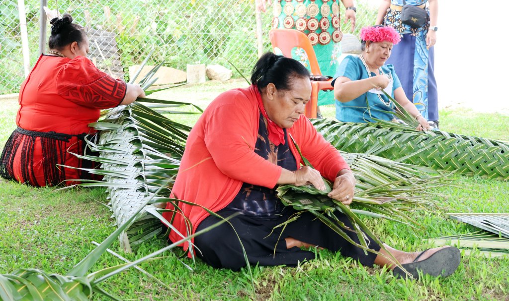 Women in Tonga weave together.
