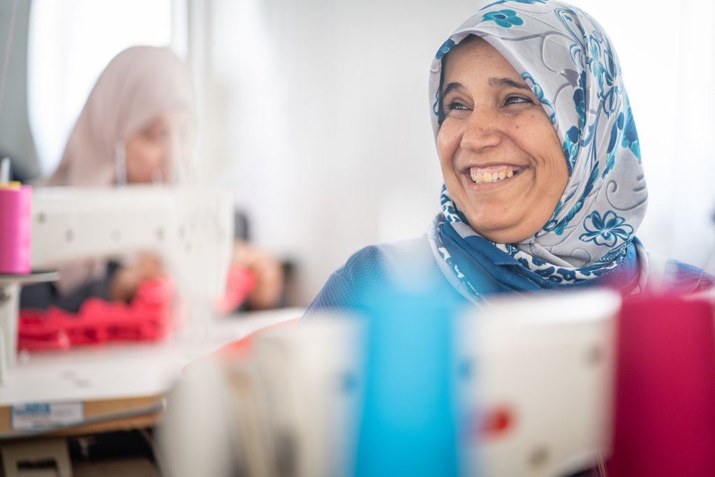 A Syrian refugee during a tailoring programme in Jordan.