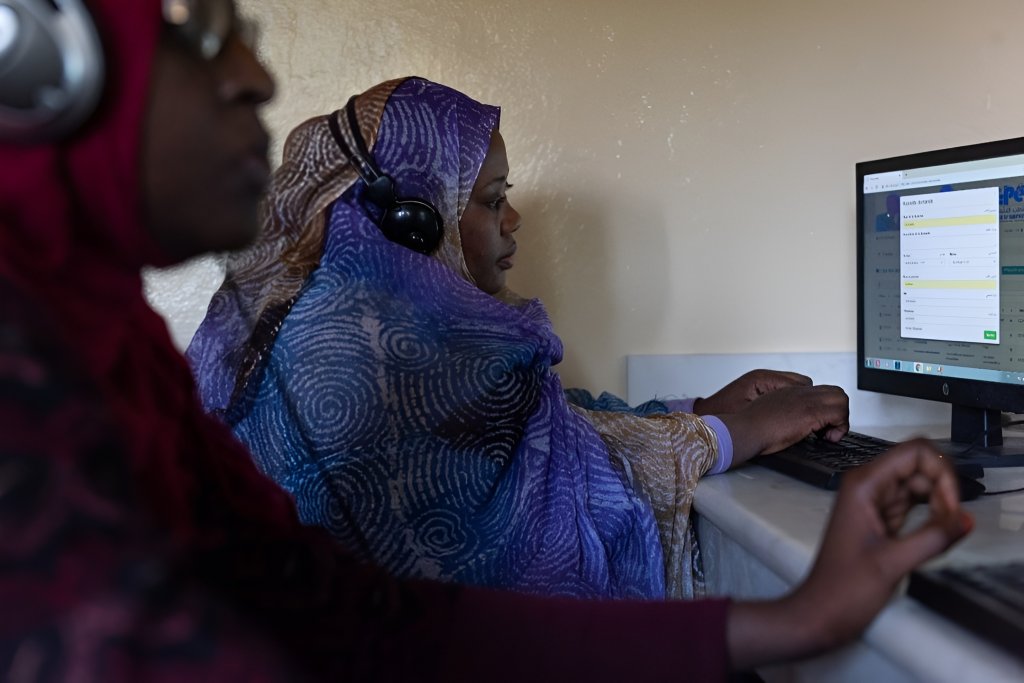 A woman uses a computer.