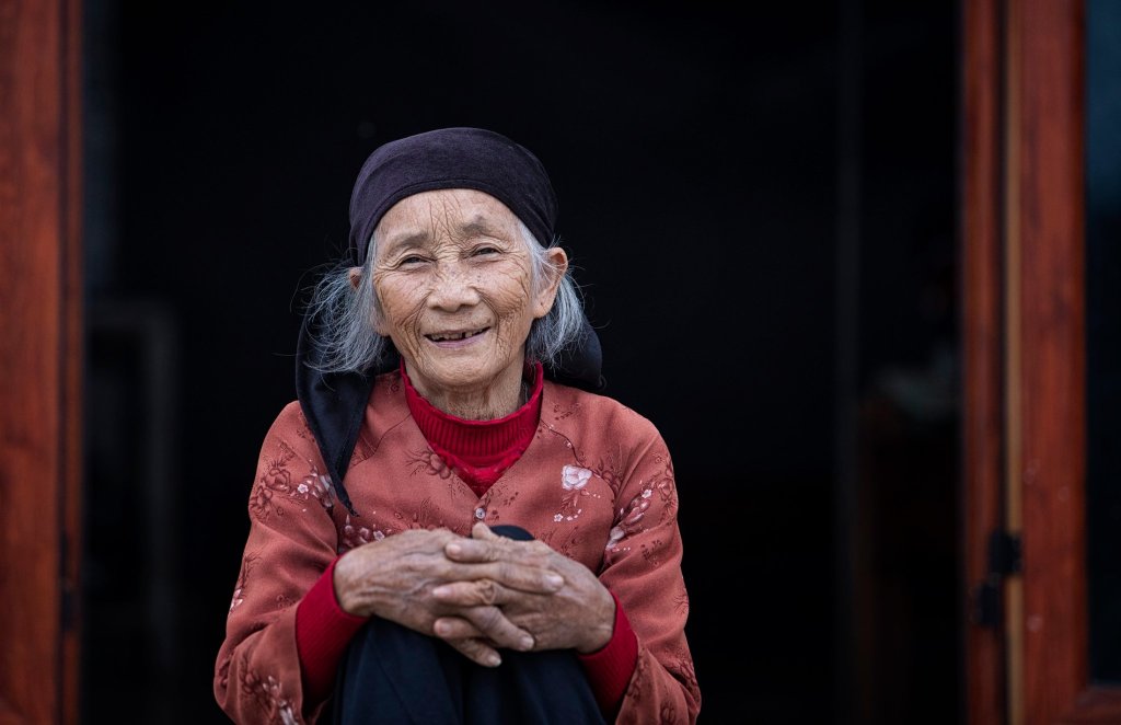 A smiling elderly woman in Viet Nam.