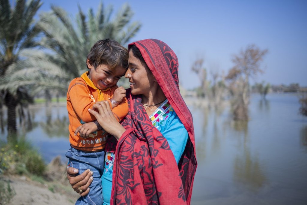 A woman in Pakistan holds her son.