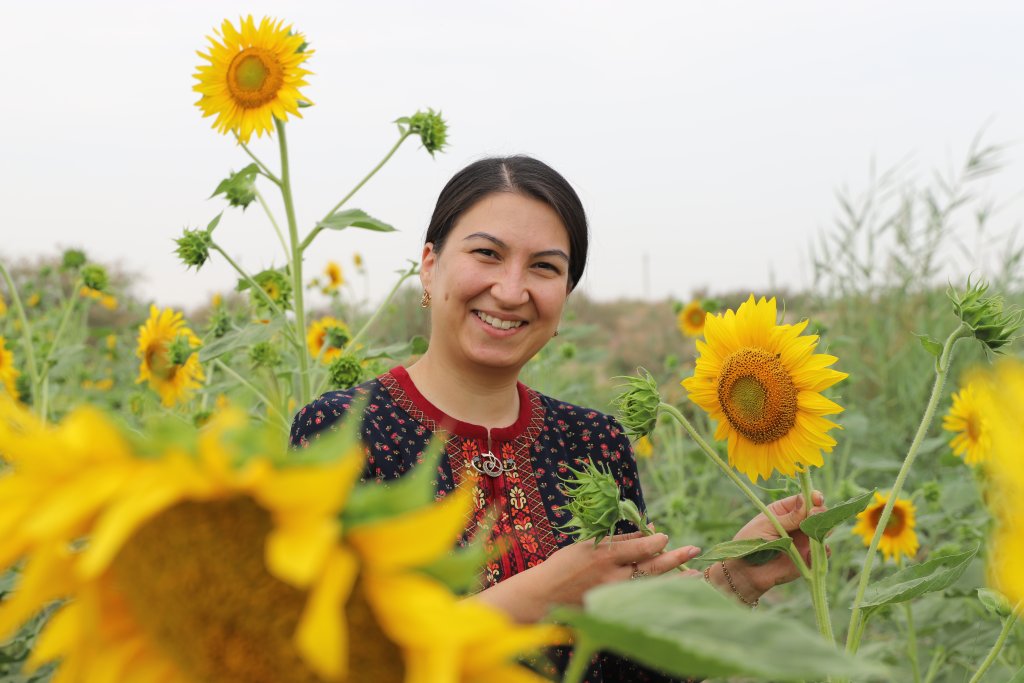 A woman in a sunflower field in Turkmenistan.