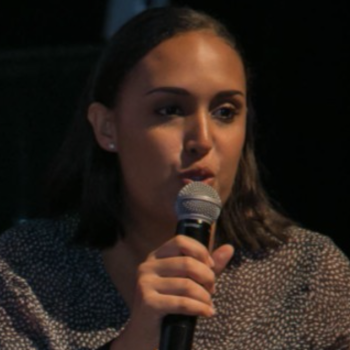 A woman holding a microphone.