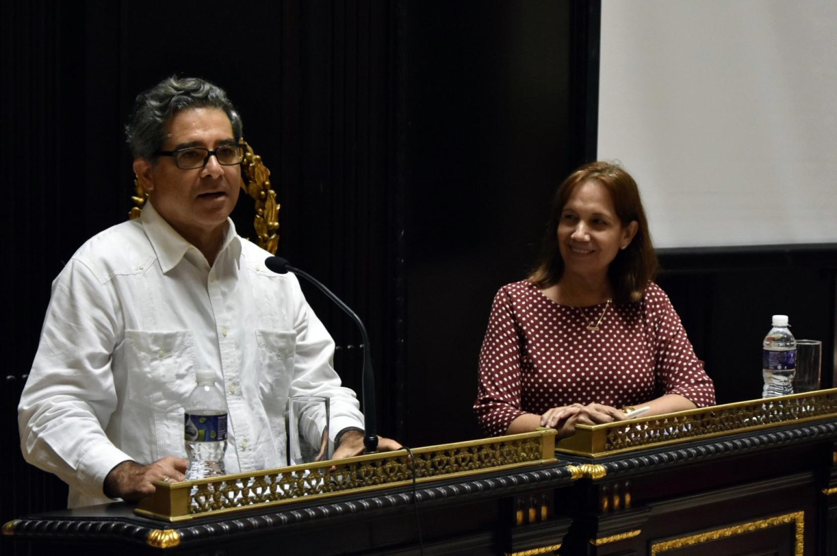 A man and a woman at the lectern in parliment