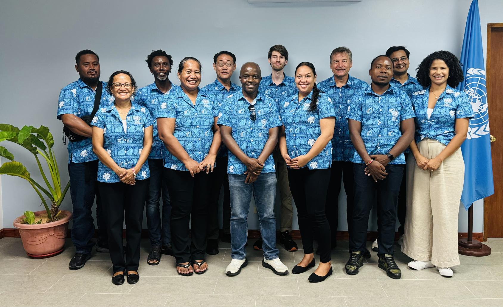 A group of people wearing colourful shirts in the UN Office in Micronesia