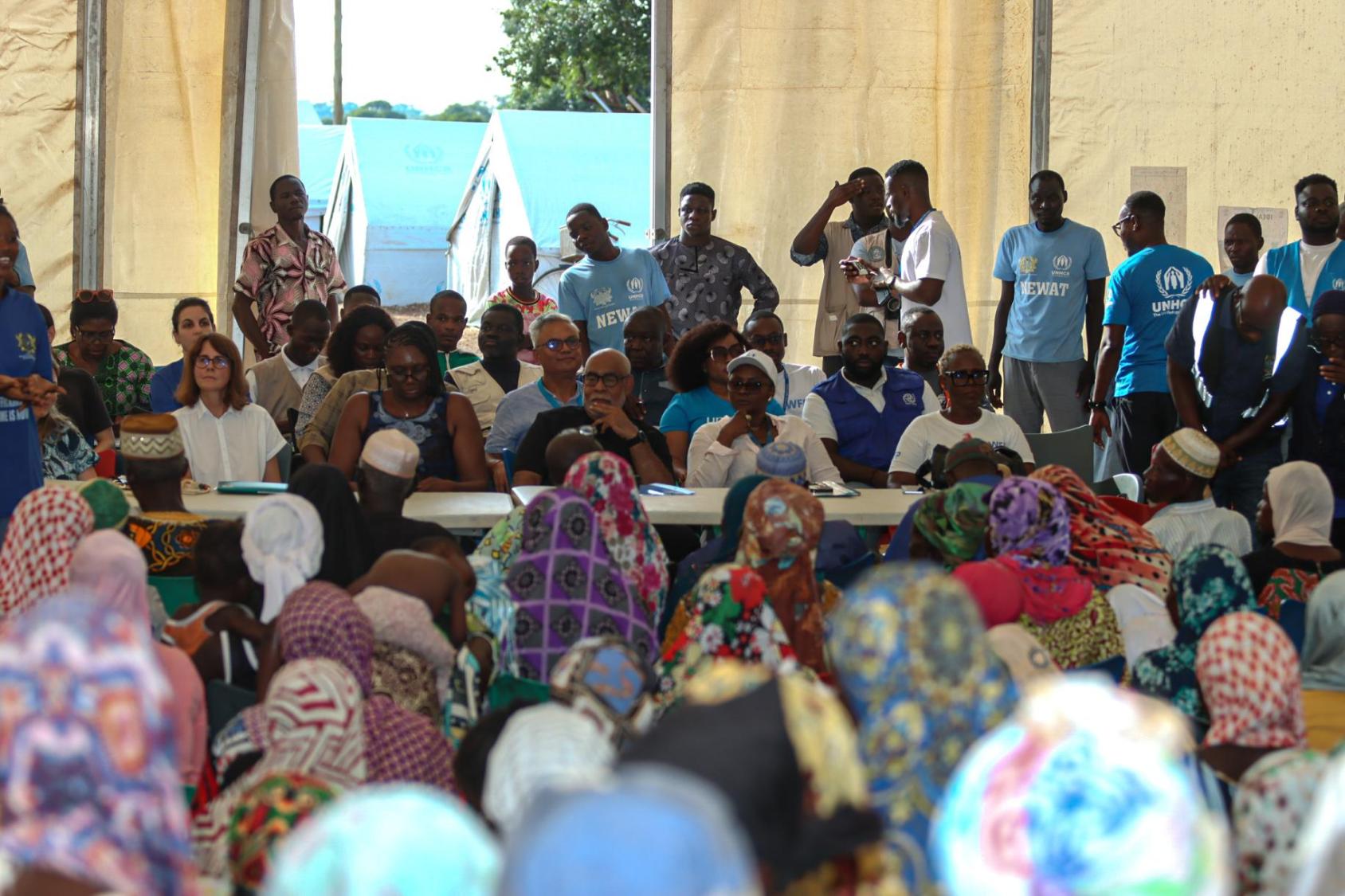 "Diverse group of refugees and asylum seekers, including people with disabilities, and the UN Resident Coordinator, gathered at a United Nations-coordinated event, showcasing inclusive humanitarian efforts in Ghana.