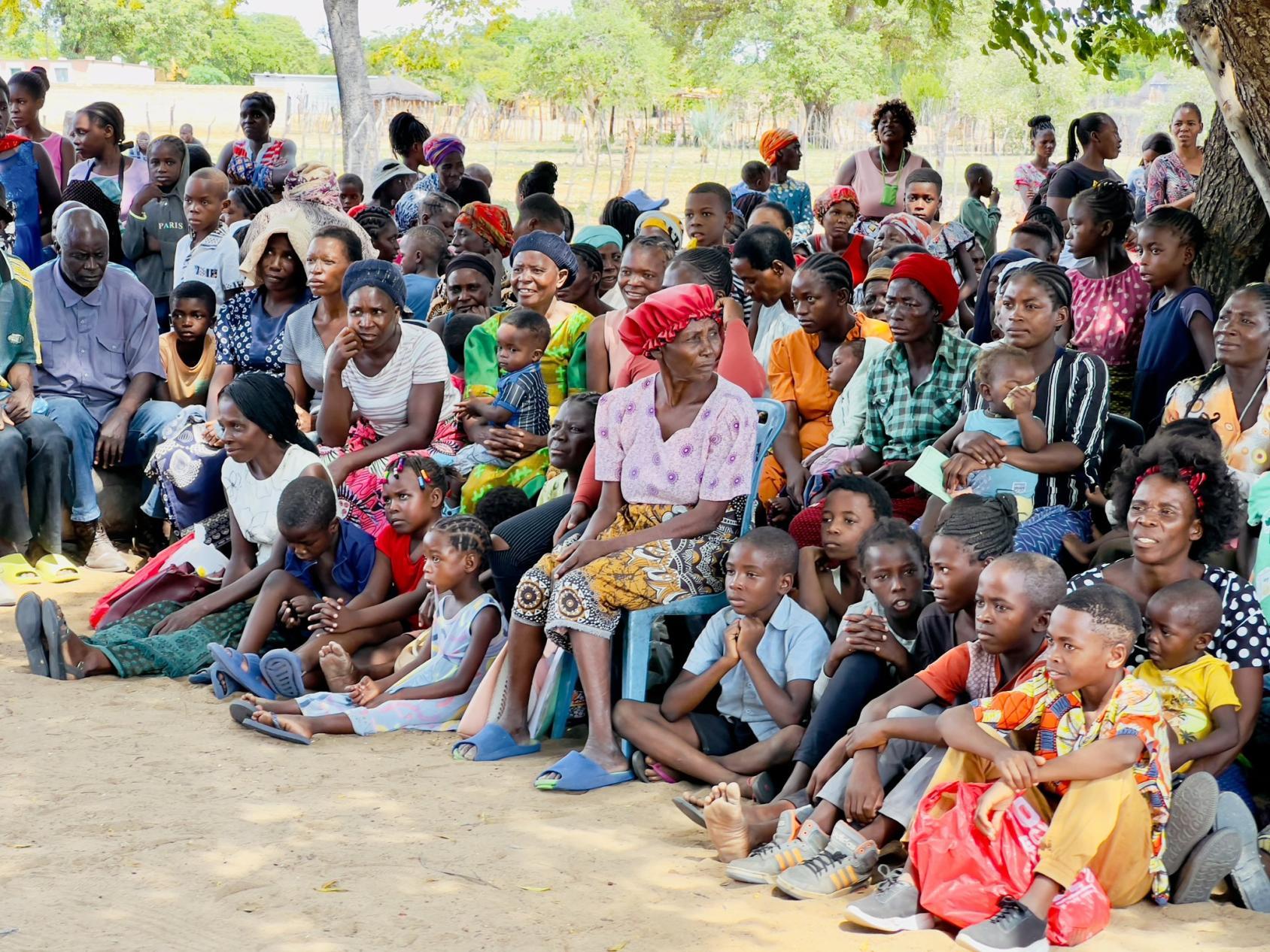 A group of women and children in an outdoor space