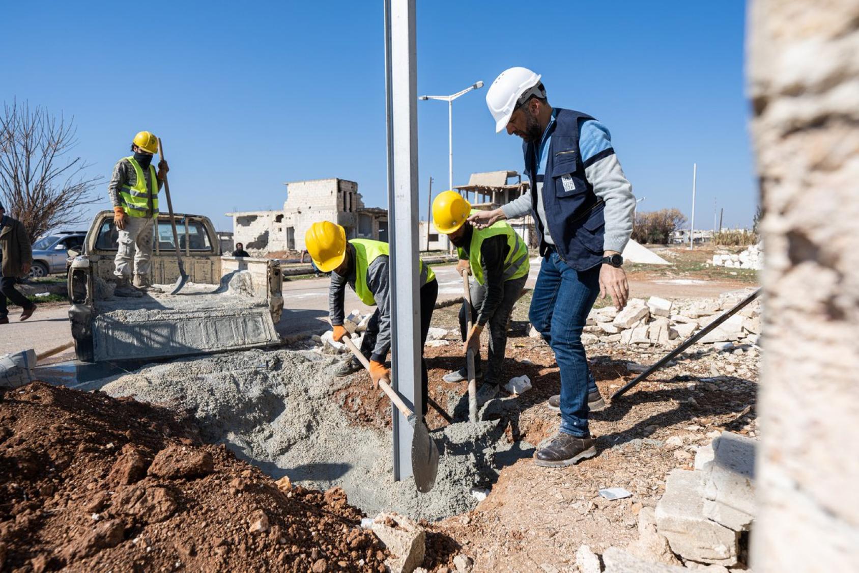 A group of people working on a construction site 