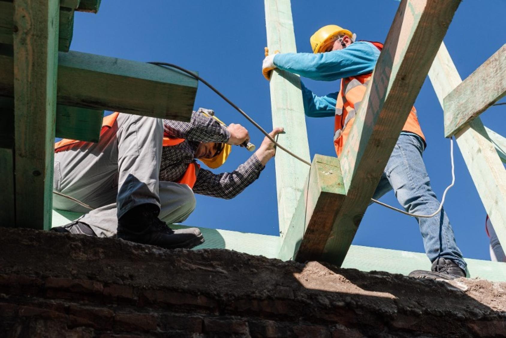 Two people working on an outdoor infrastructure project