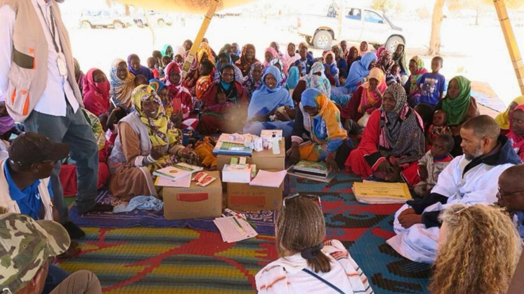 A group of people engaging in community dialogue