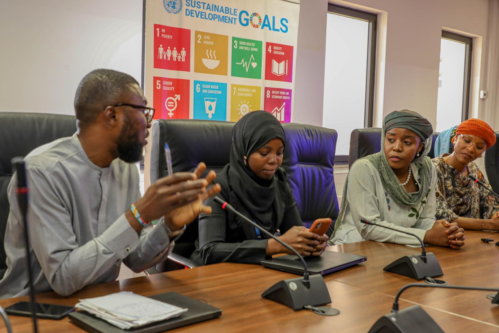 A group of young people engaging in a discussion