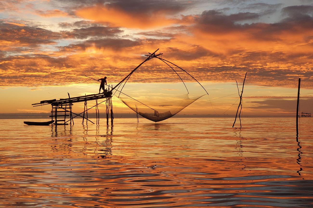 sunset view of old fashioned fishing nets