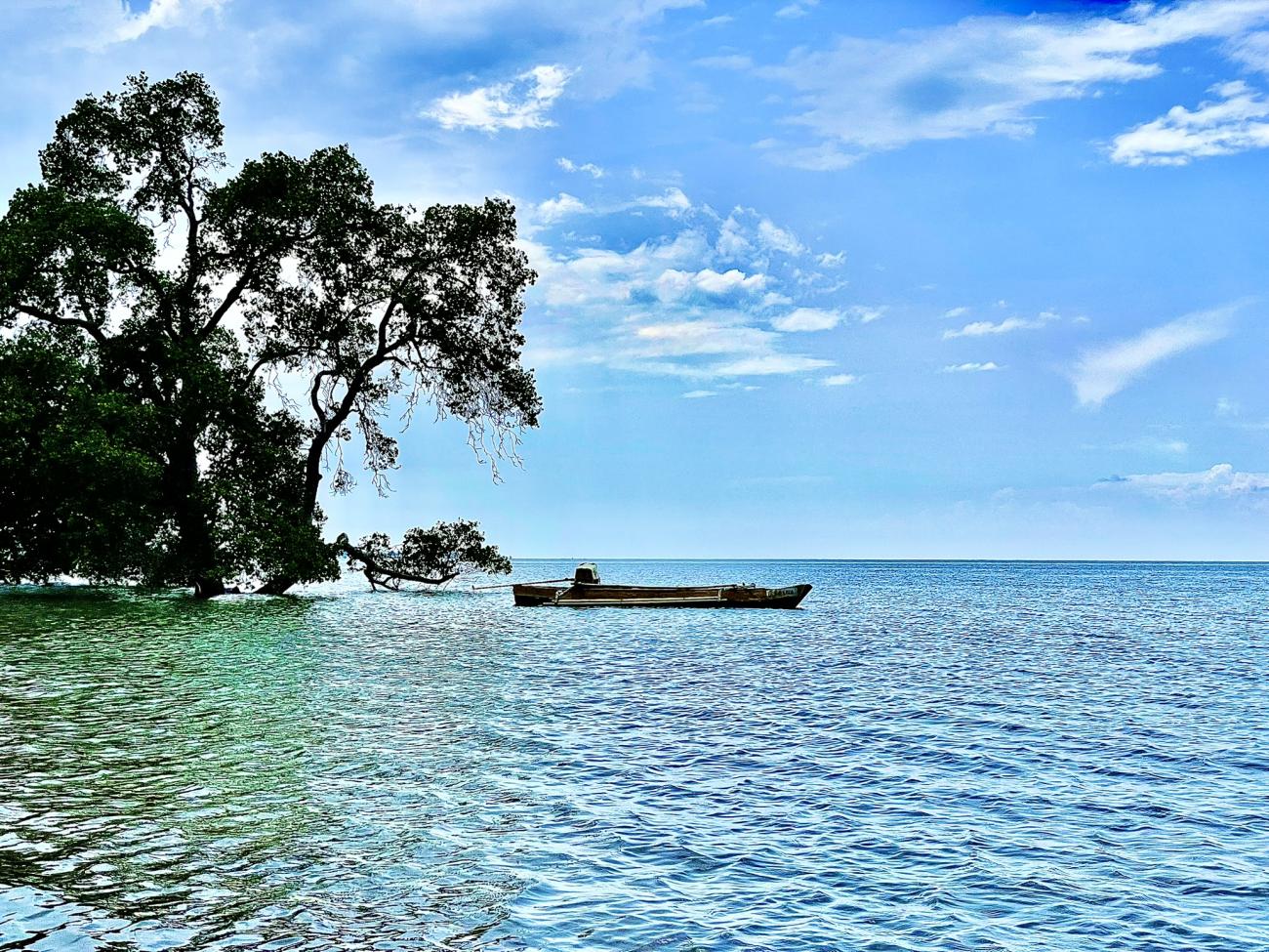 A beautiful seascape with a boat in view 