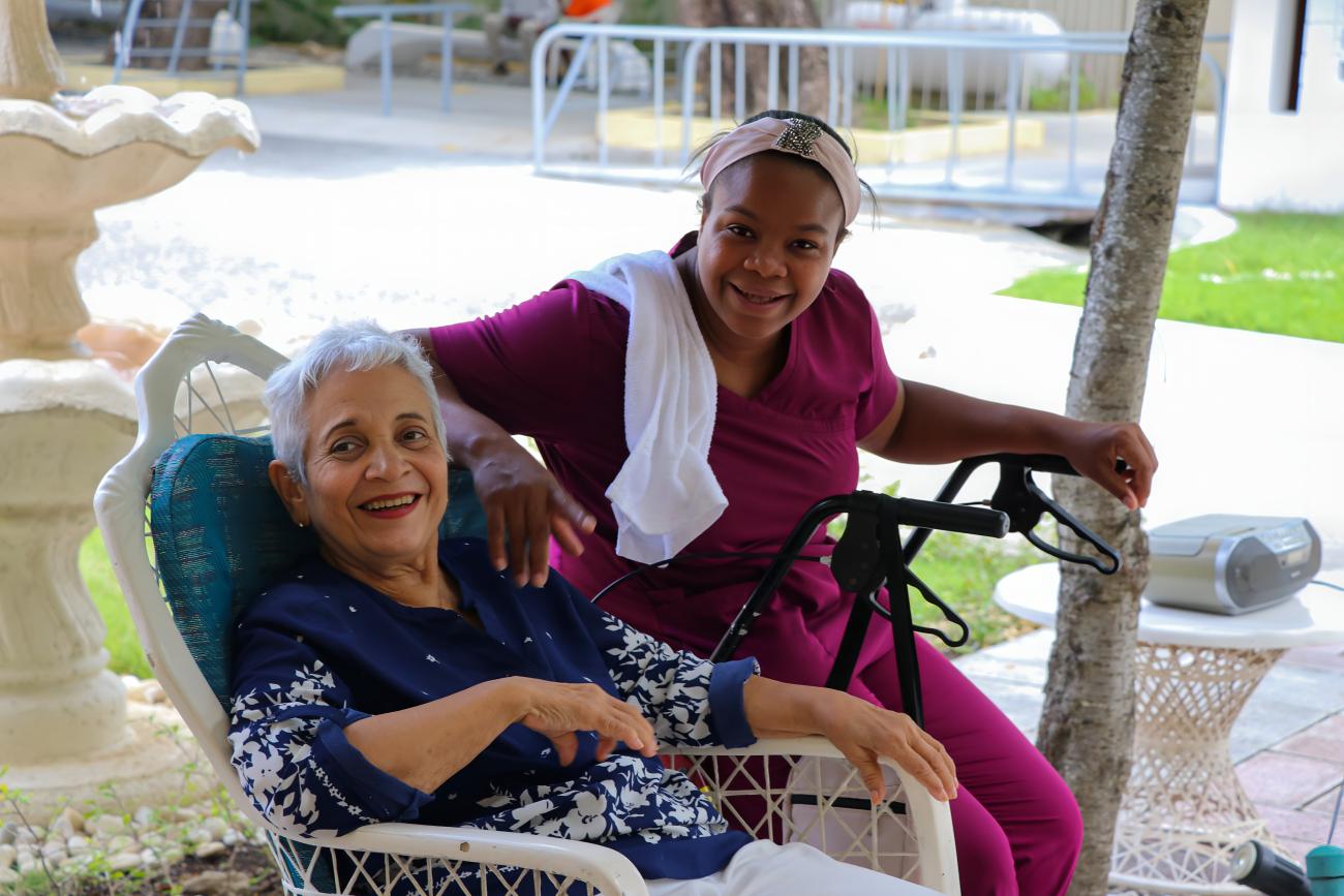 An elderly woman in the Dominican Republic with her caretaker.