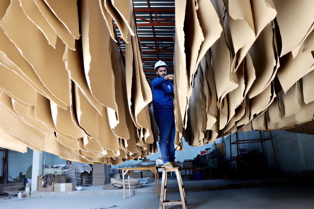 A man in Afghanistan works in a paper factory.