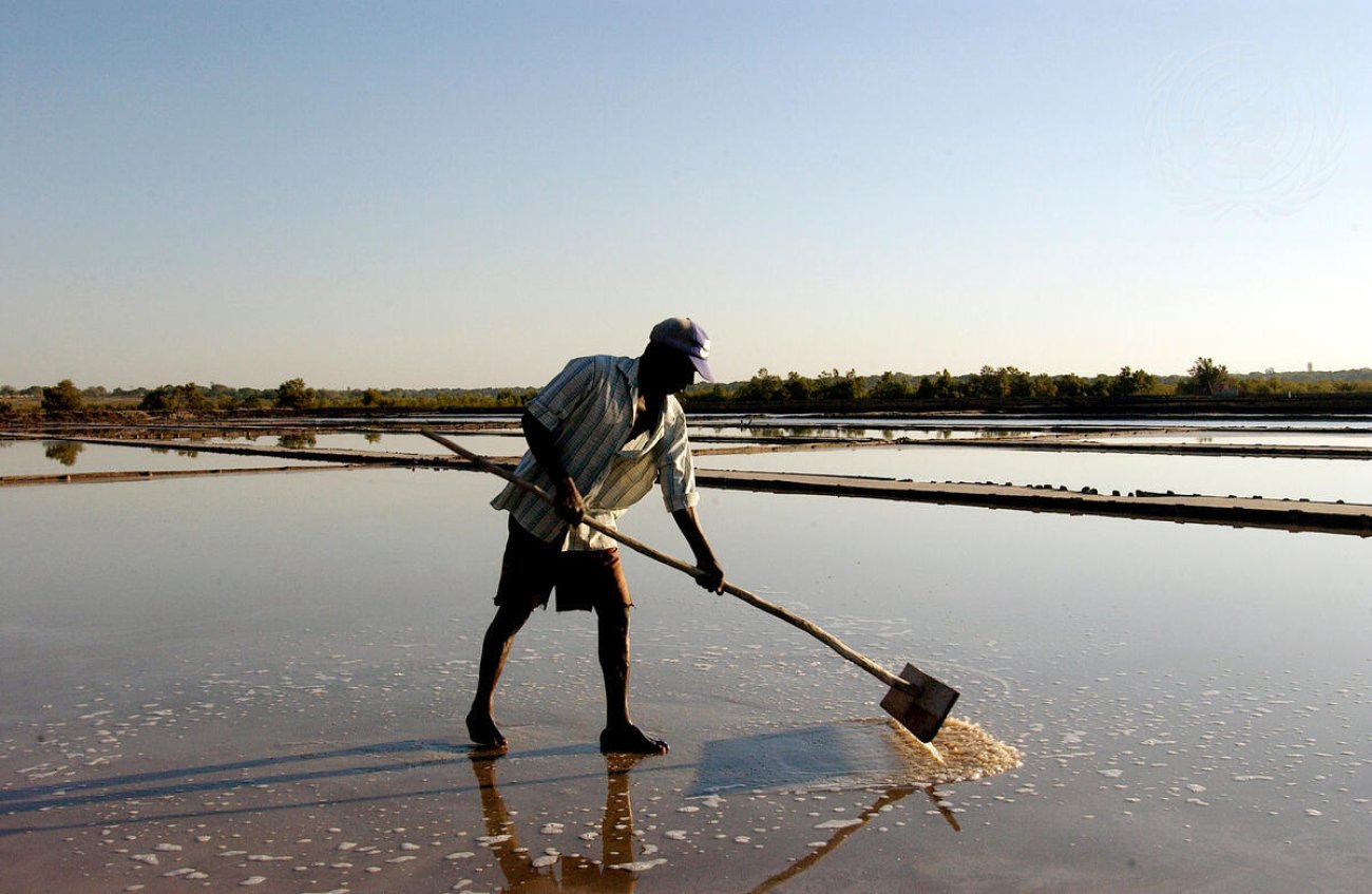A man processes salt in Mozambique.
