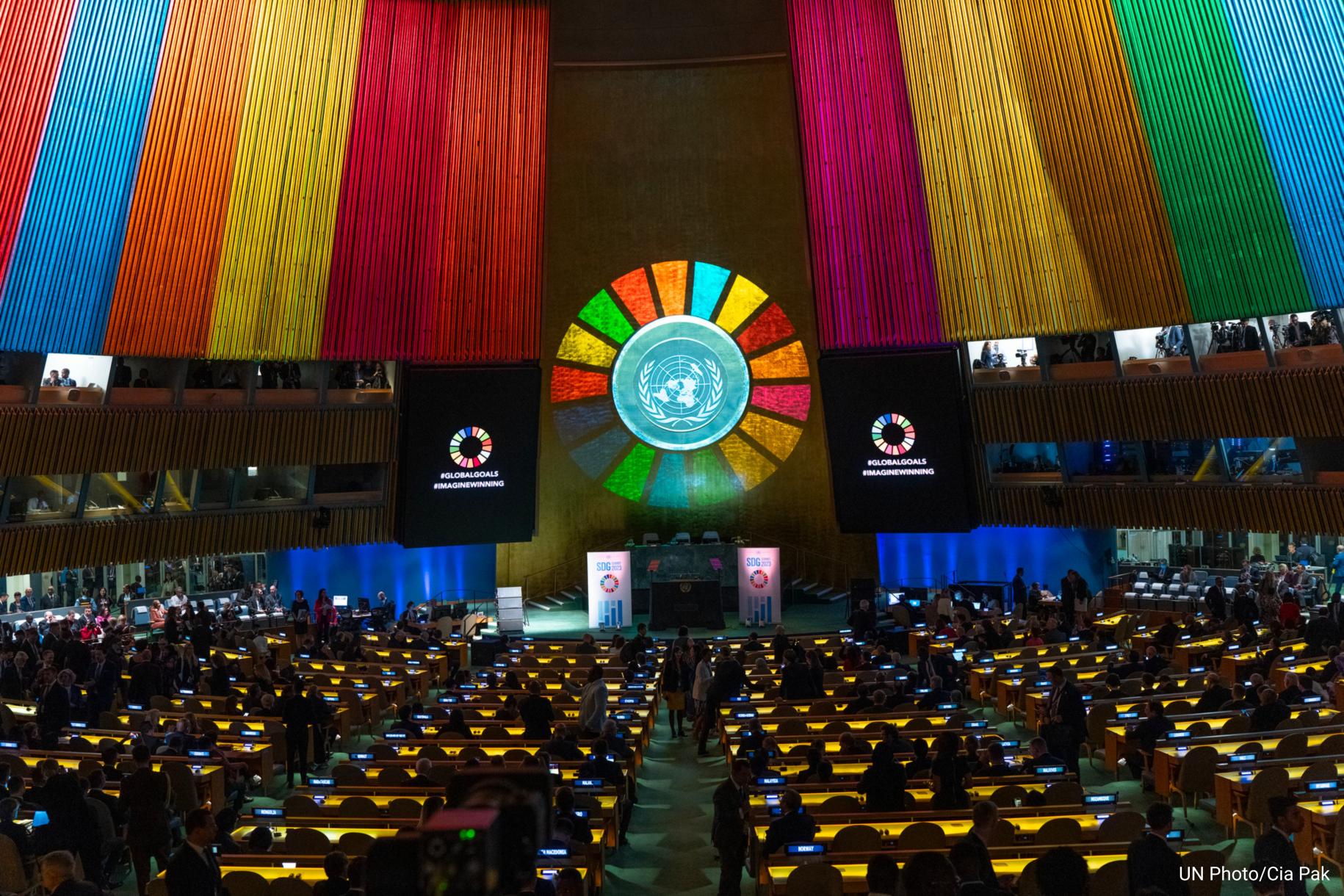 General Assembly hall light up with projection of SDG wheel. 