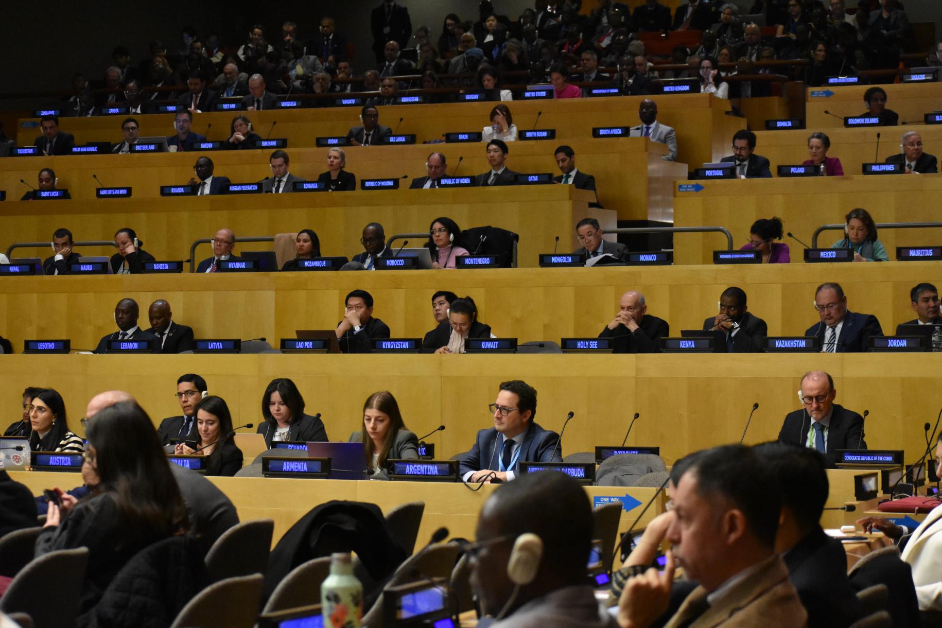 rows of people sitting in meeting room 