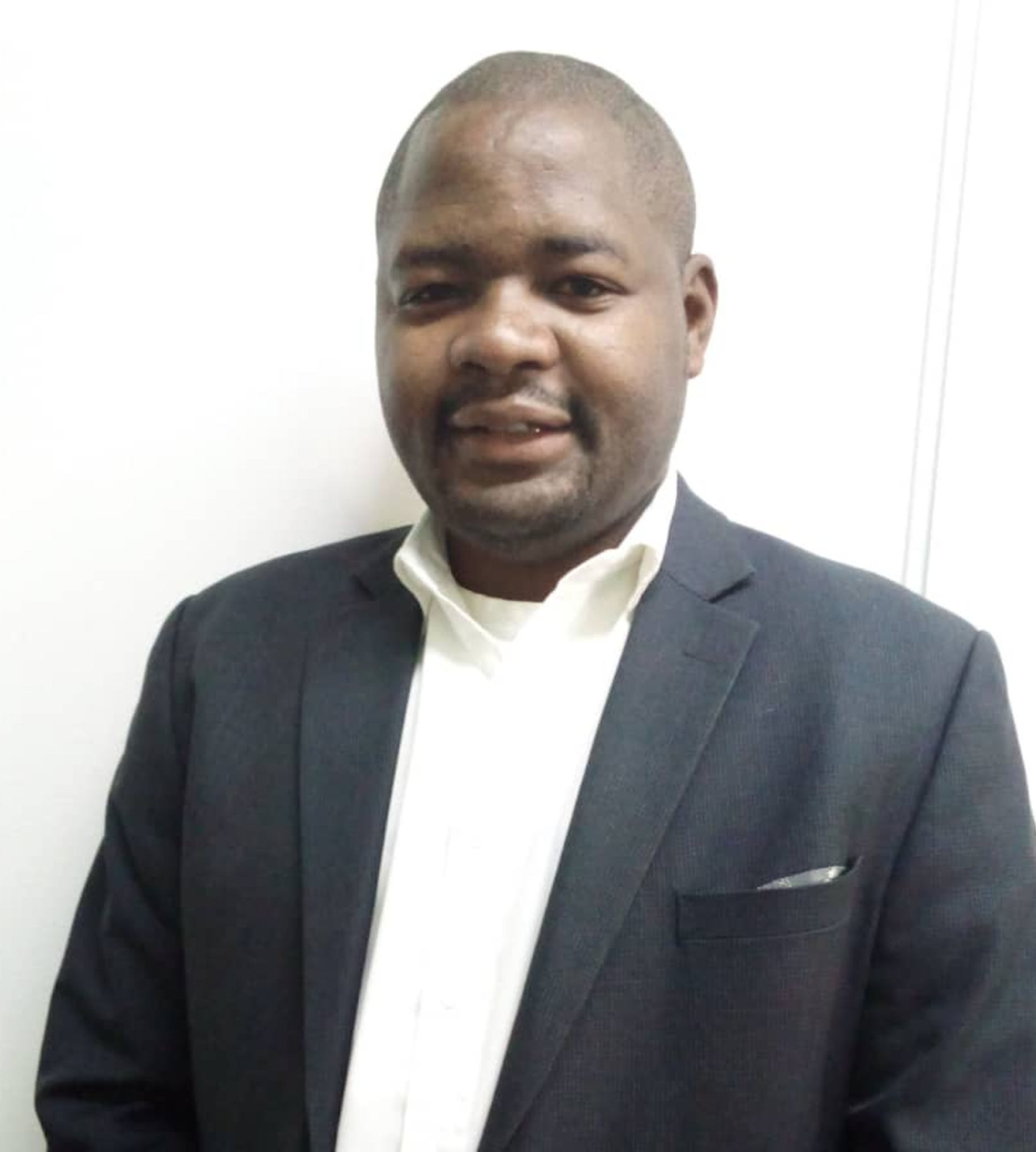 Moses Chubili standing against white background