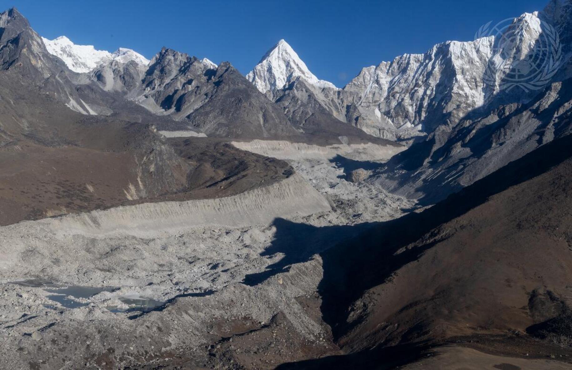 snow covered mountains against blue sky
